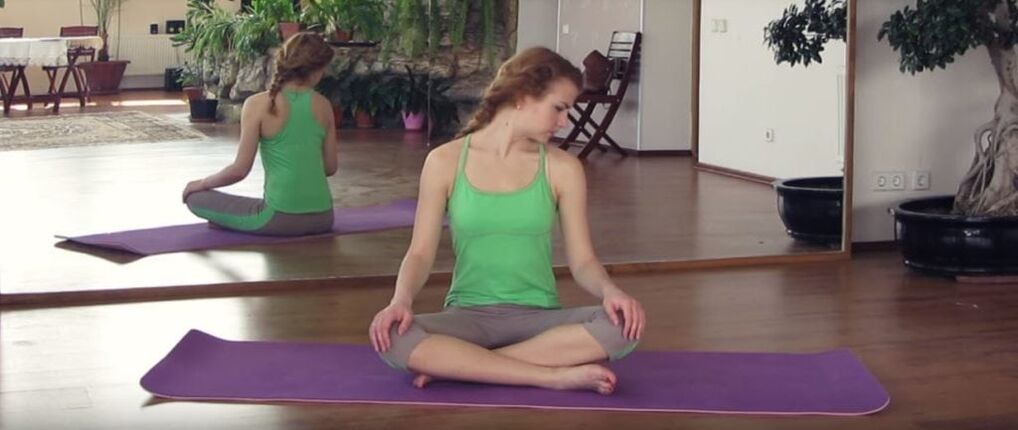 The girl is engaged in physical therapy for the treatment of cervical osteochondrosis.